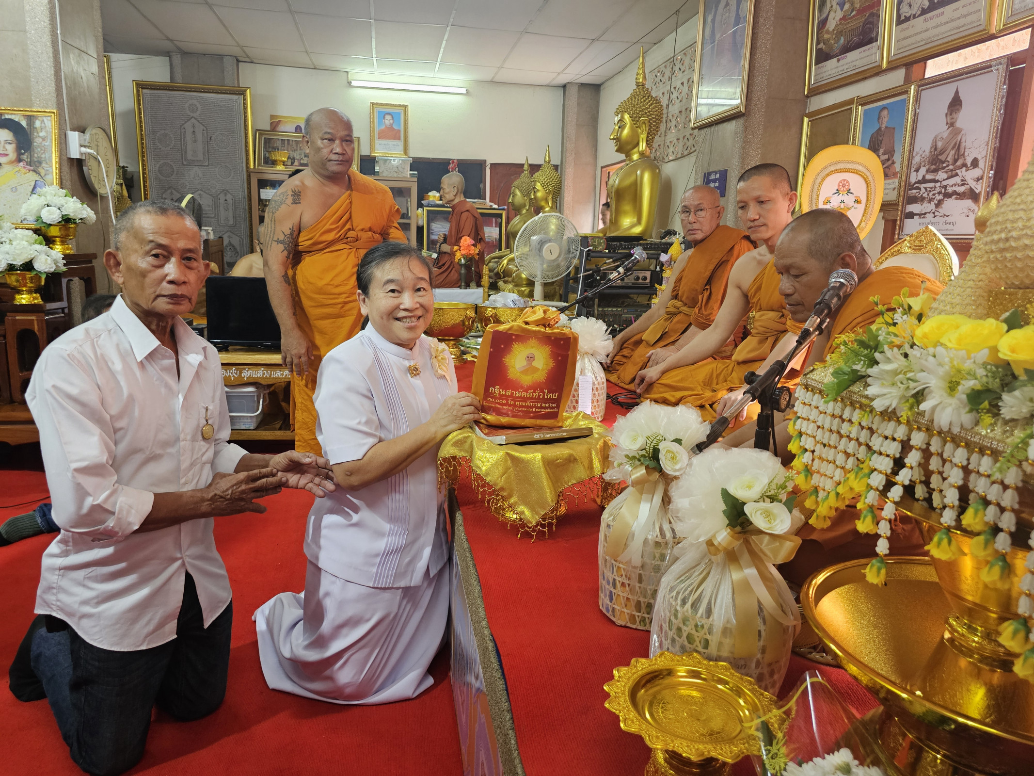 ภาพการถวายปัจจัยวัดตนุ