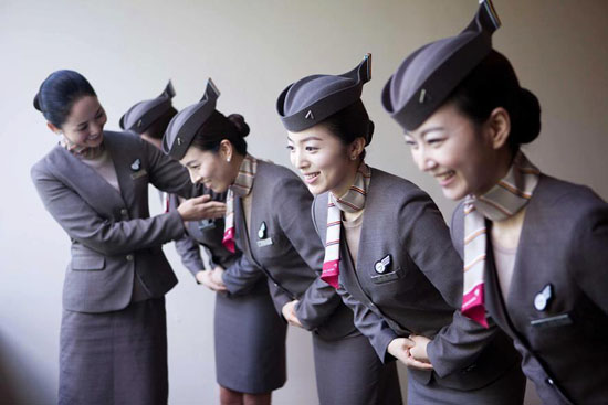 Stewardess or Air hostess = พนักงานต้อนรับบนเครื่องบิน