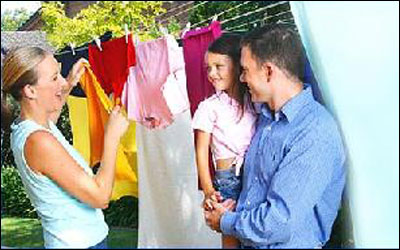 The mother should teach the child how to hang the clothes to dry by categorizing.