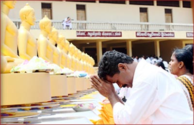   The way Buddhists worship the Lord Buddha is by bowing.